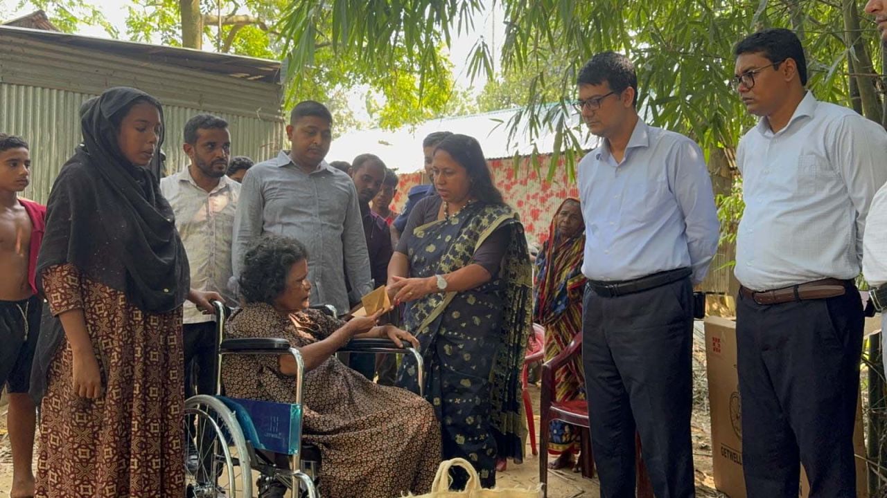 ঝিনাইগাতীতে দশ বছর পর ঘরের বাইরে ঝমেলা, হুইলচেয়ারে বসালেন ডিসি